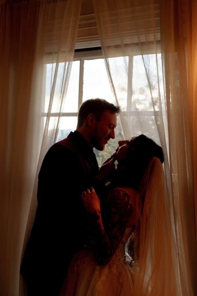 grant humphreys mansion wedding couple in window kissing